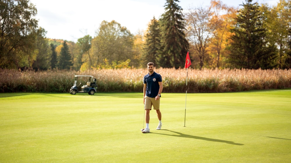 a person standing on a golf course