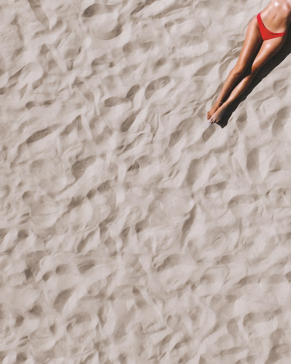 a person's feet in the sand