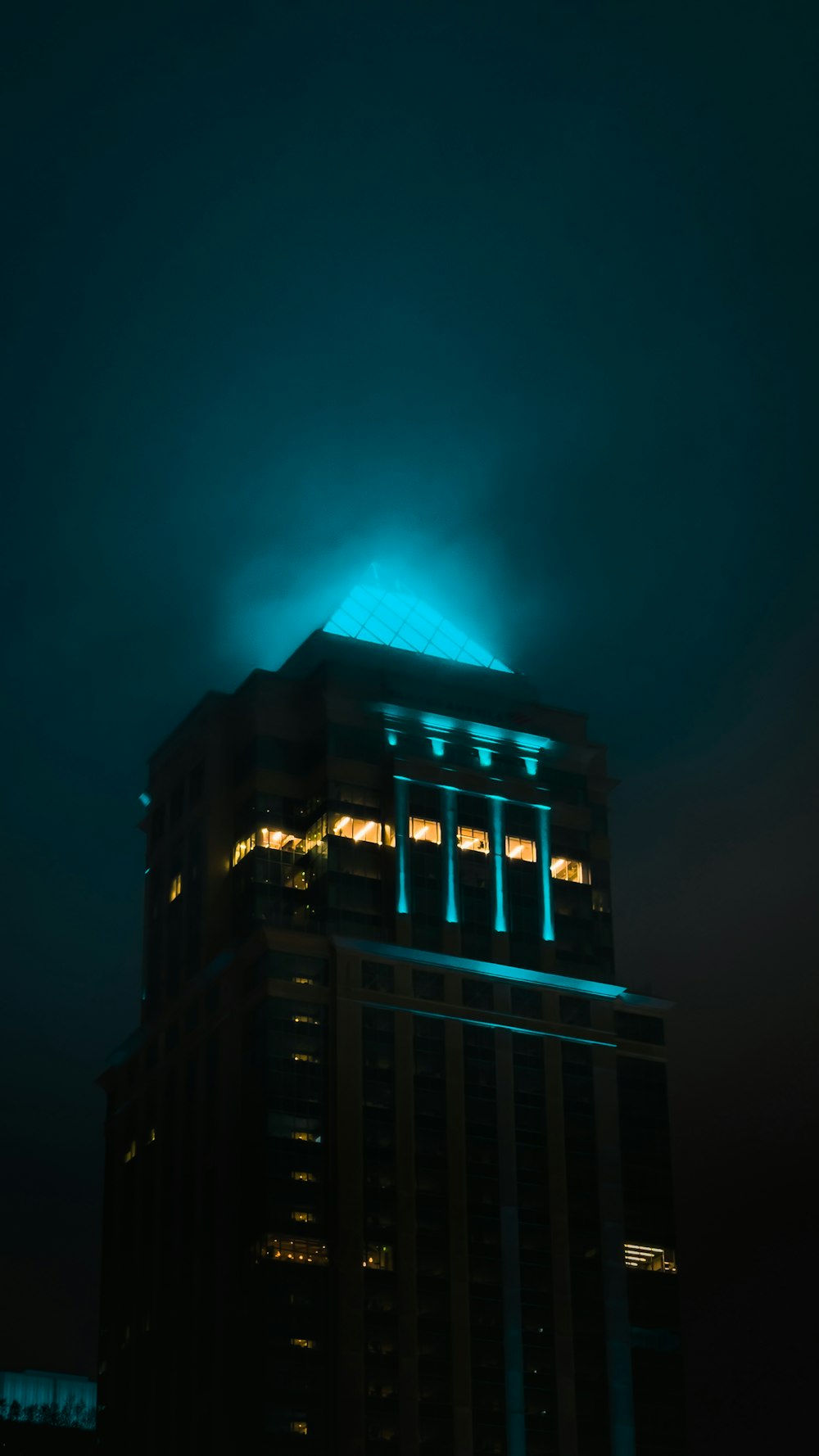 a tall building with lights at night