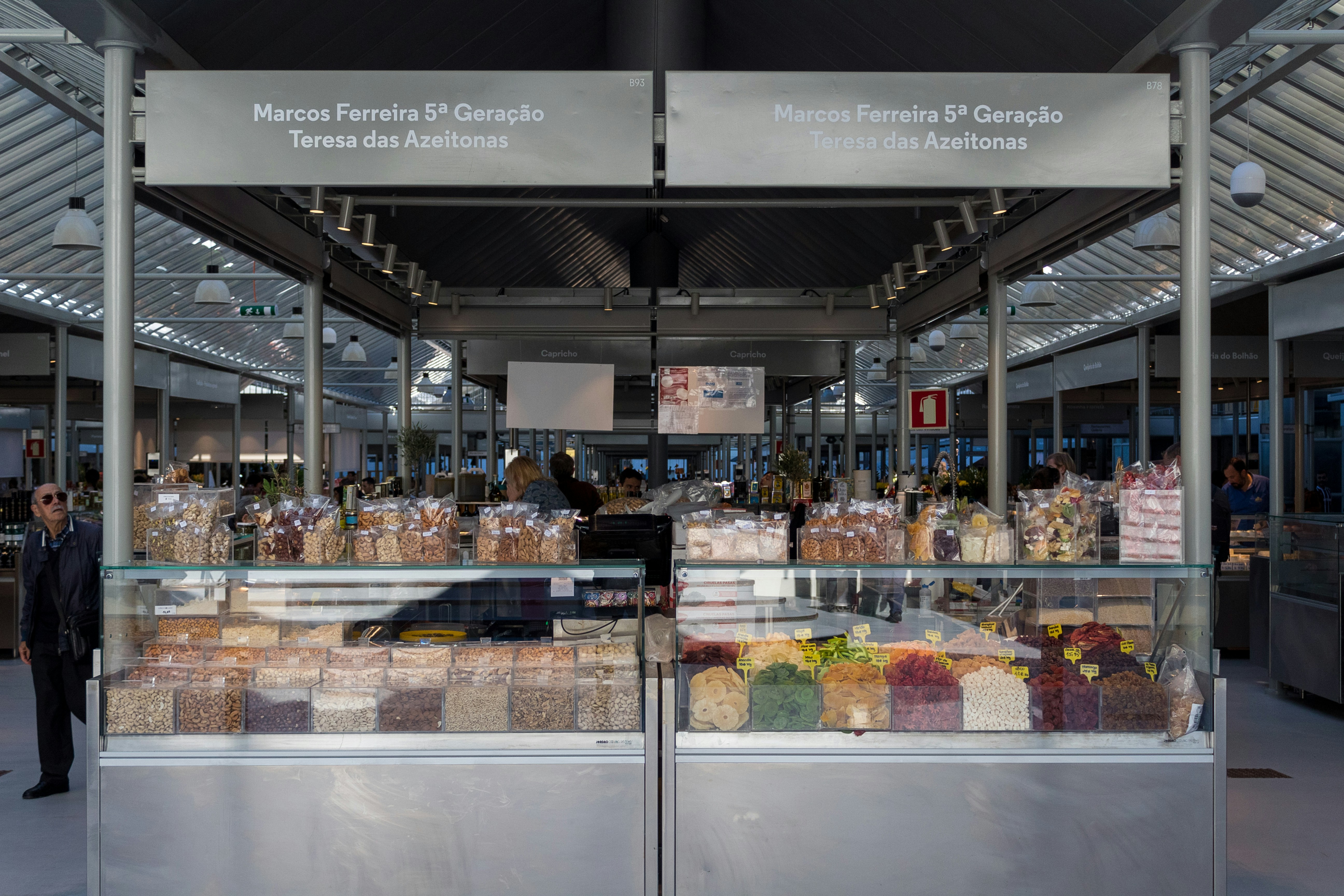 a person standing in front of a counter with food on it