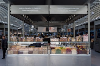 a person standing in front of a counter with food on it