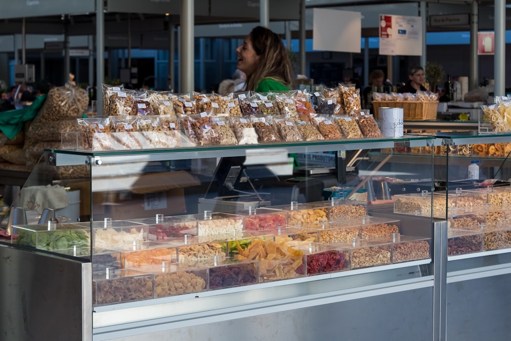 a person looking at a display of food