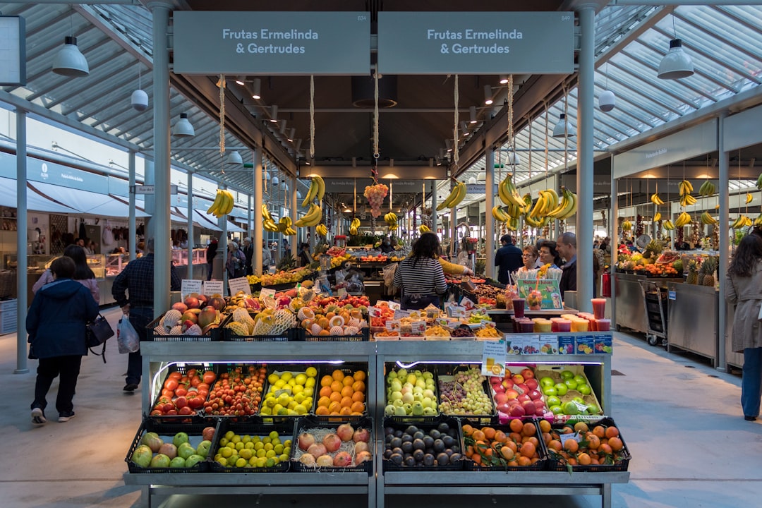 a fruit stand with fruits, Lots of fruit in Mercado do Bolhão.