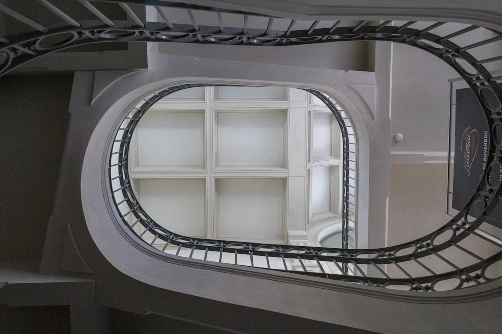 a circular staircase with a railing