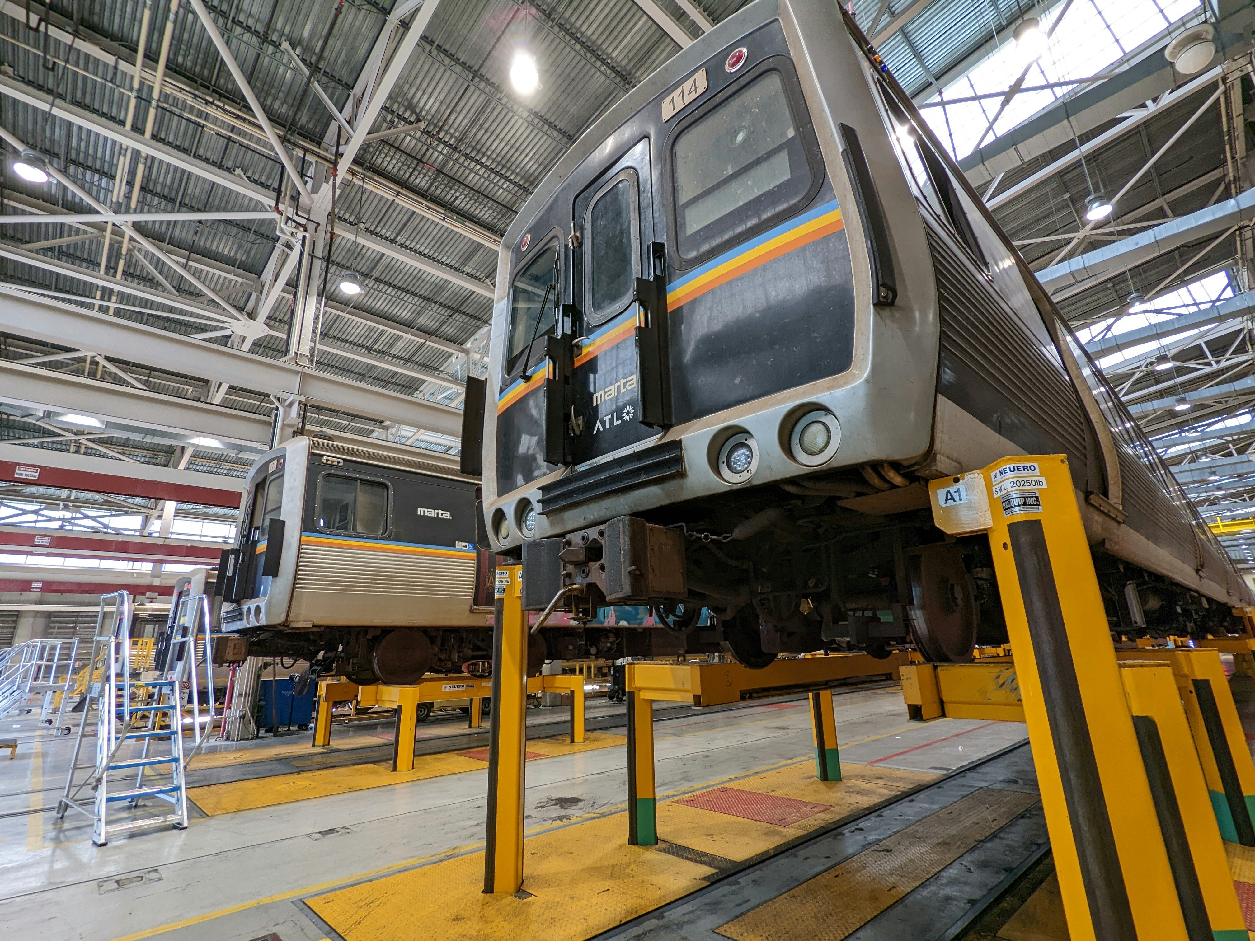 a couple of trains in a station