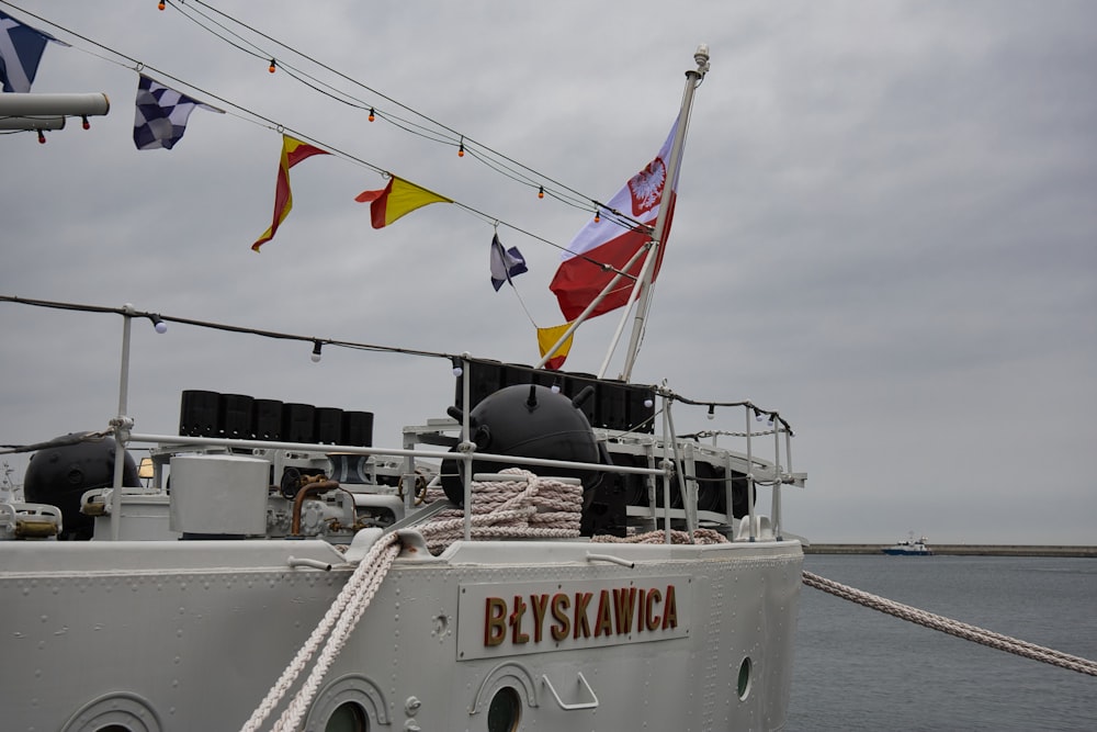 a boat with flags on it