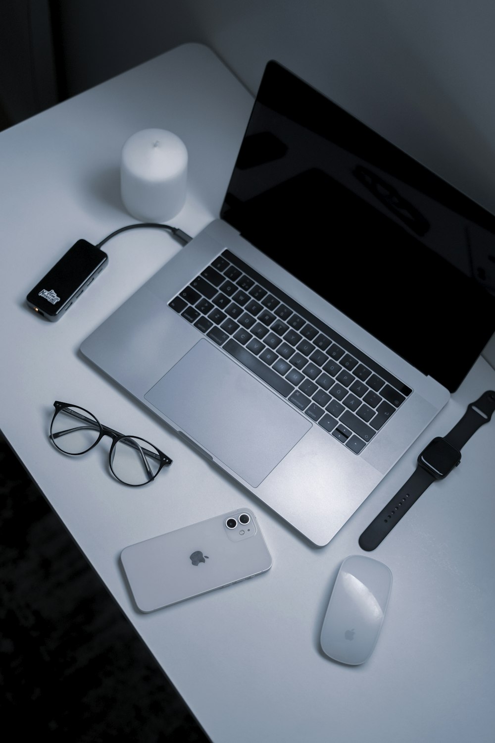 a laptop and a mouse on a table