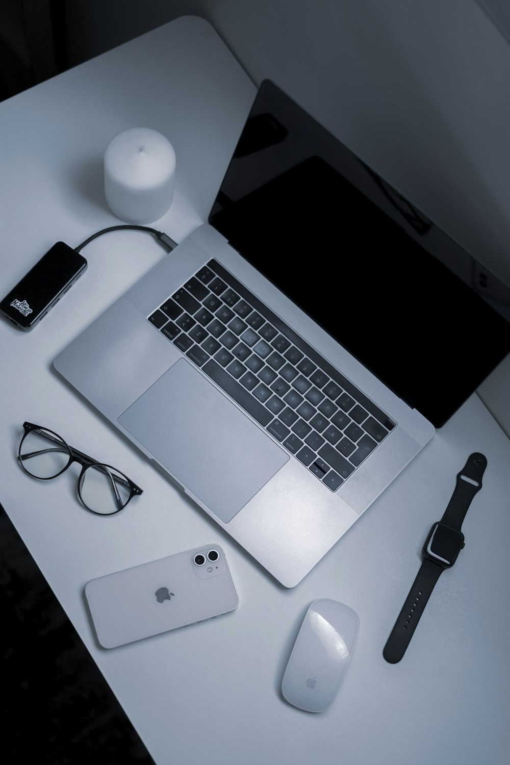 a laptop and a pen on a table