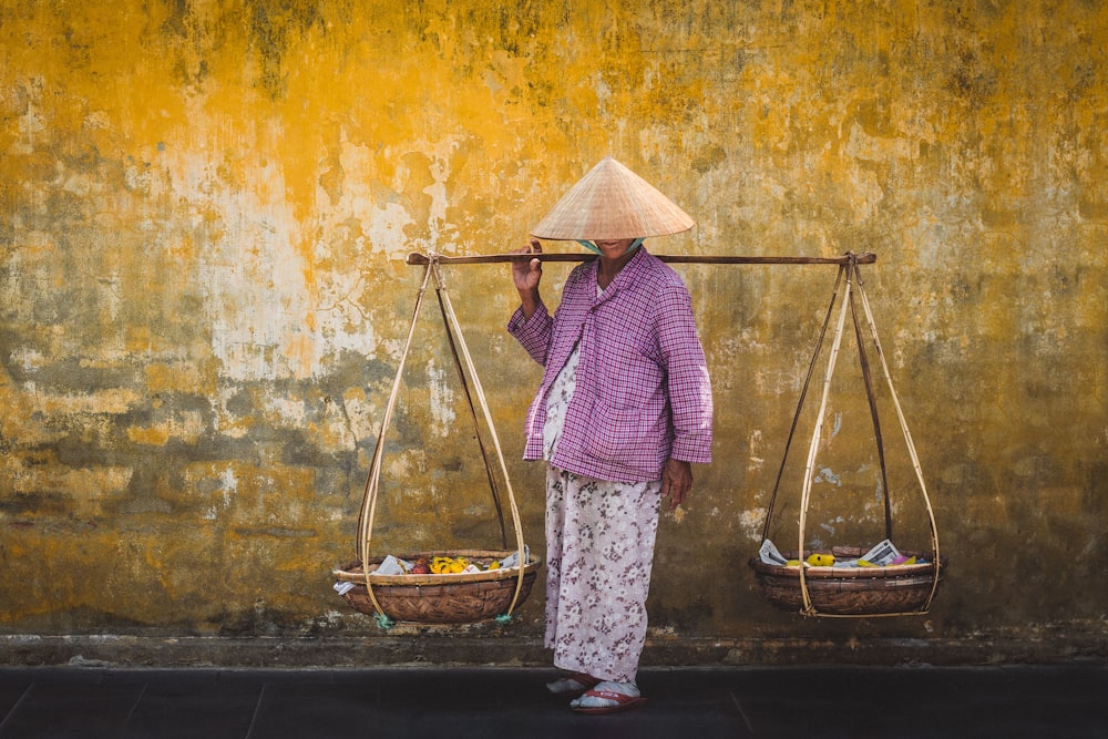 a person holding a basket of food