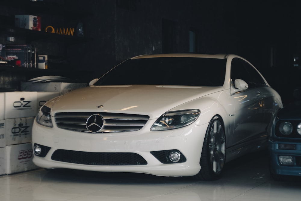 a white car parked in a showroom