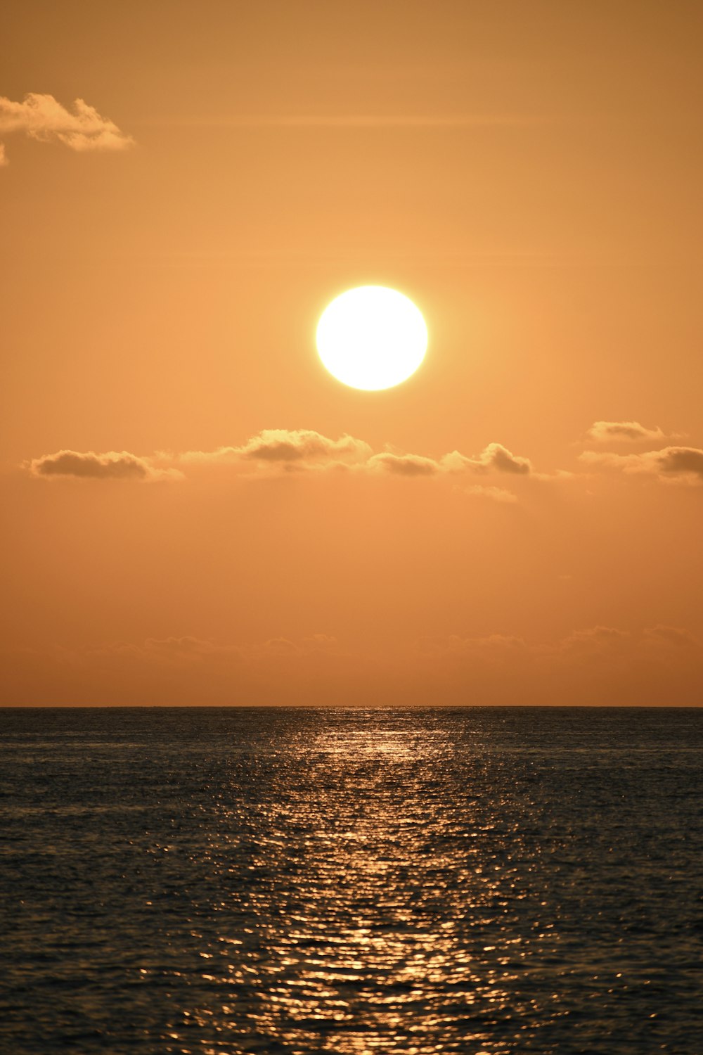 a sunset over a body of water