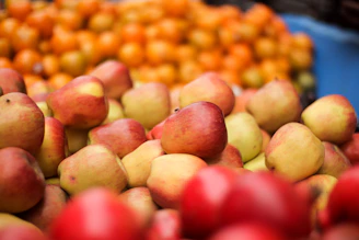 A vibrant screenshot of a colorful fruit puzzle game with juicy apples and oranges.