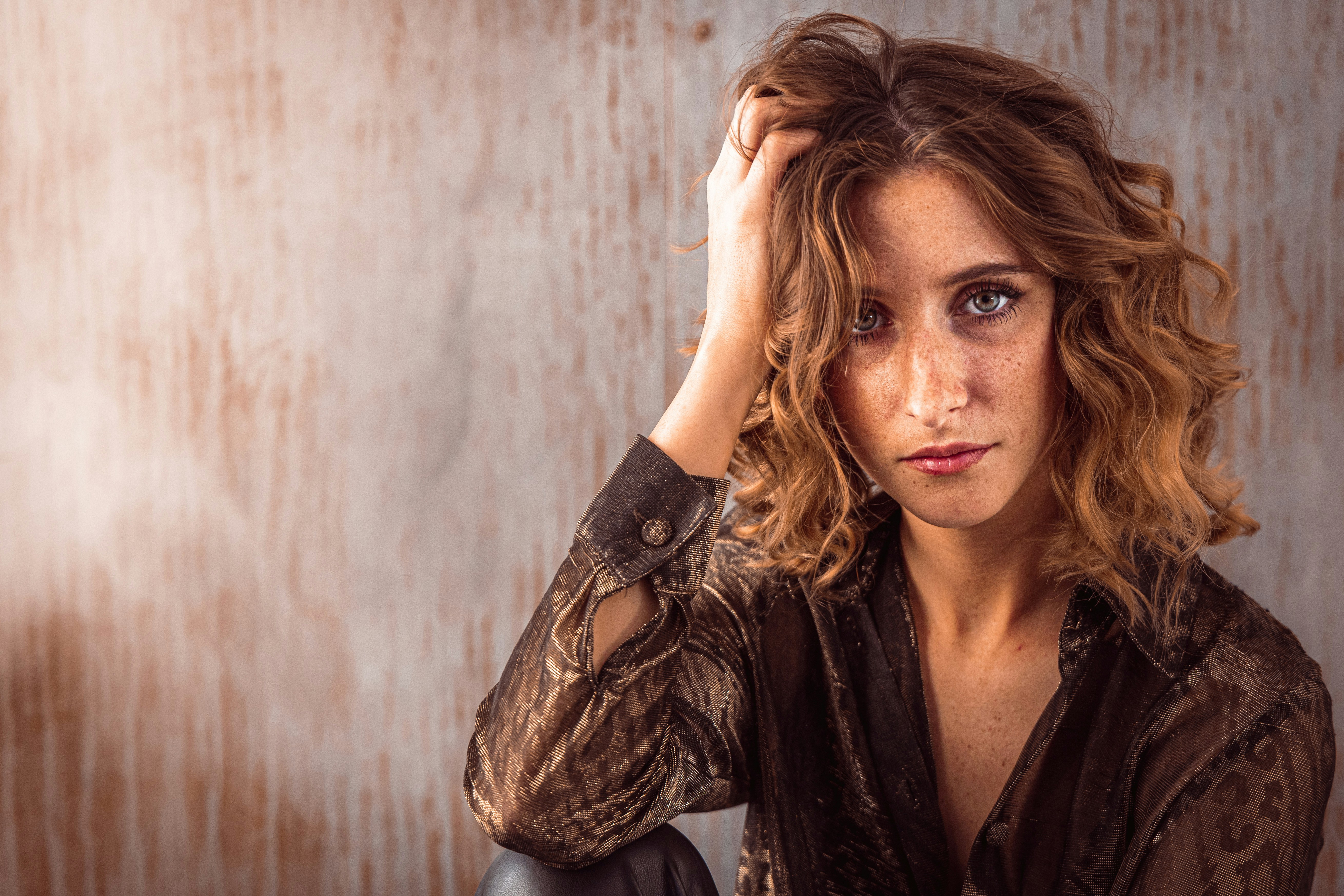 Woman with hand on head