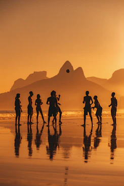 A group of people playing with a ball on Ipanema Beach in Rio de Janeiro