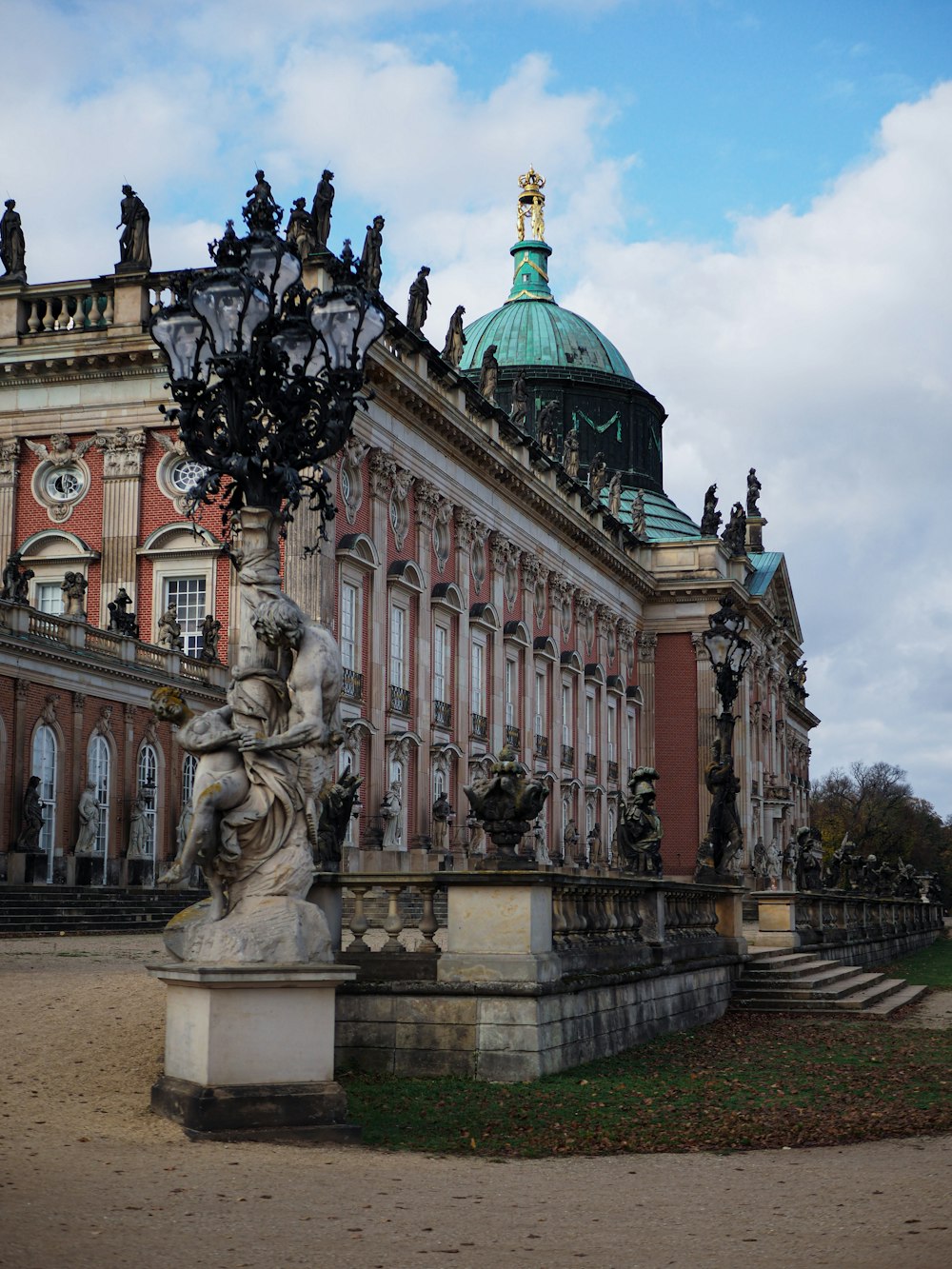 a large building with a statue in front of it