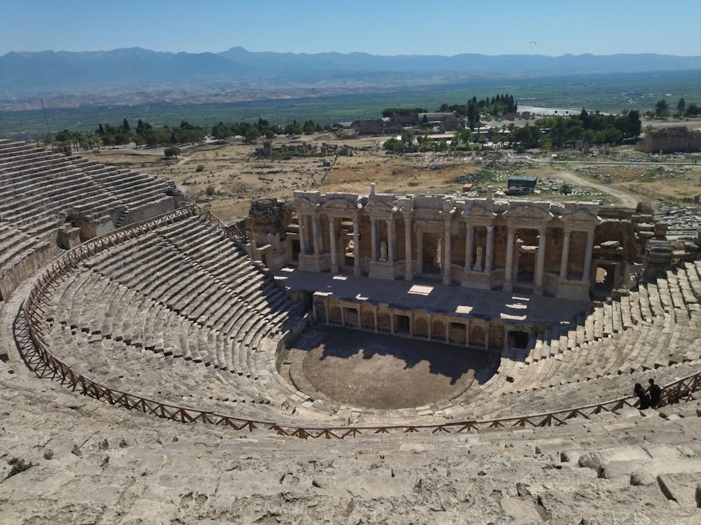 an ancient building with many columns with Hierapolis in the background