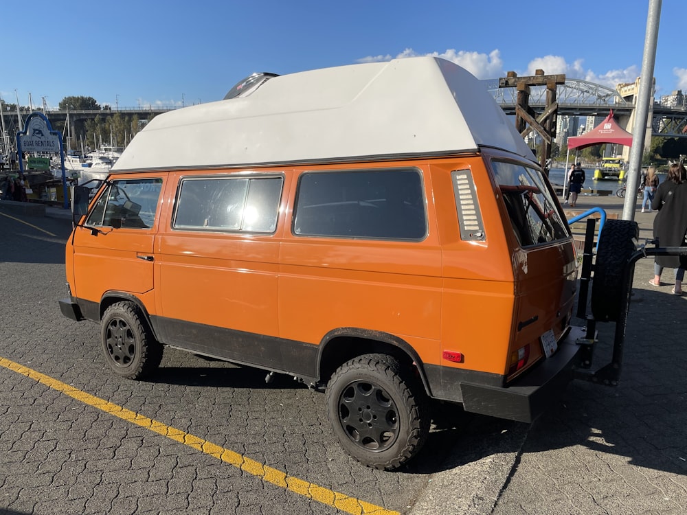 an orange van with a white cover