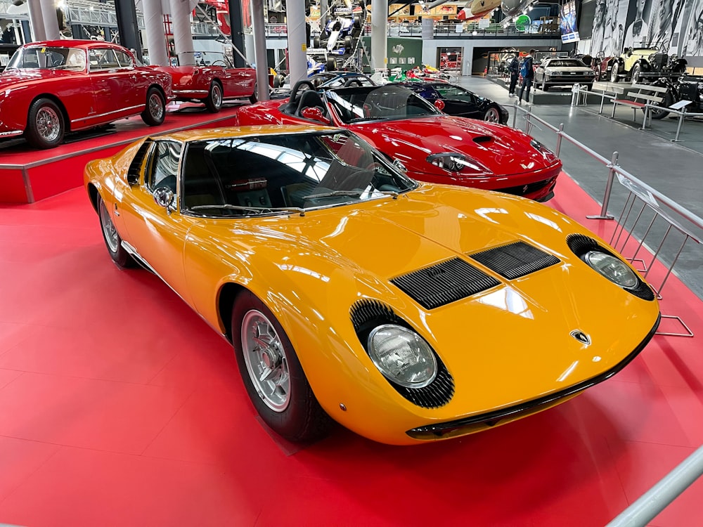 a group of cars parked in a showroom