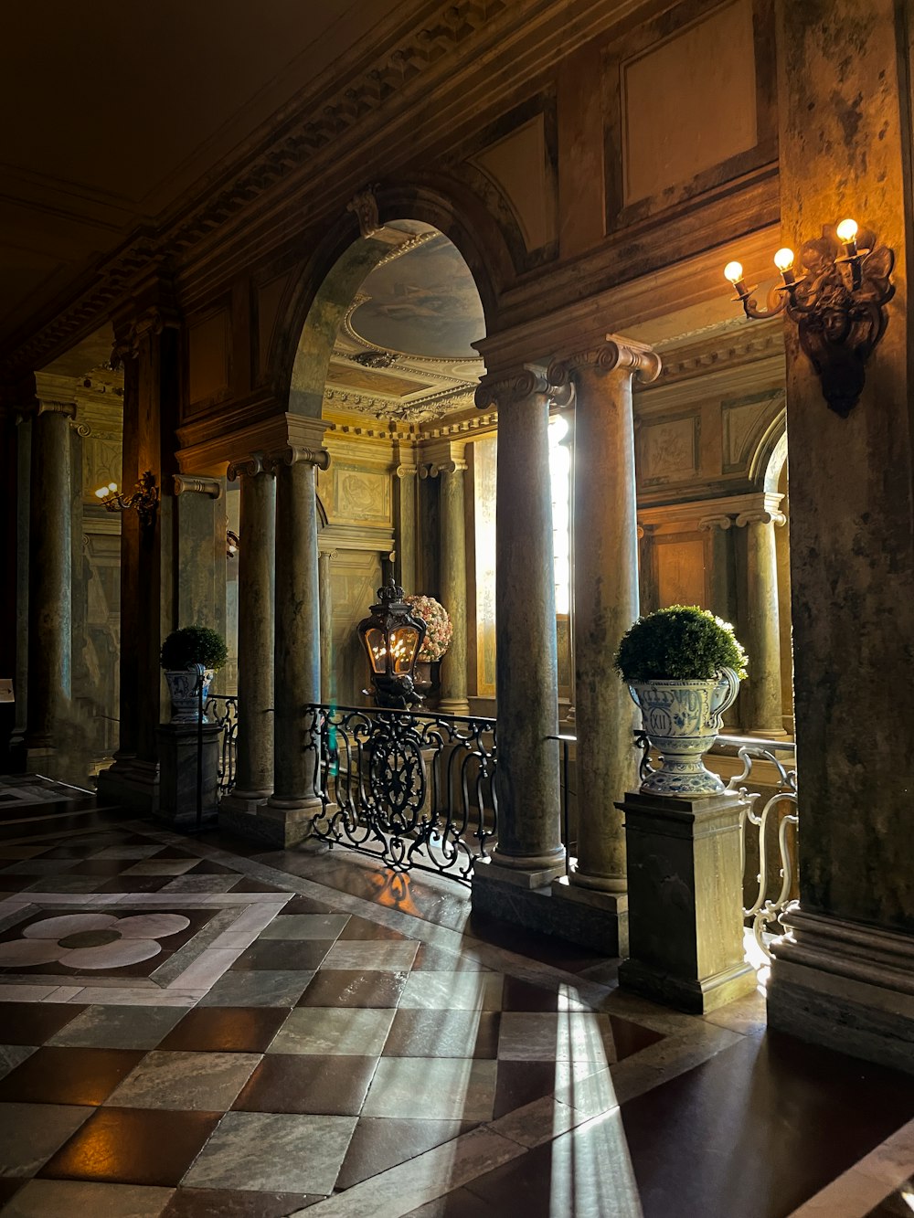 a large room with a large vase of flowers