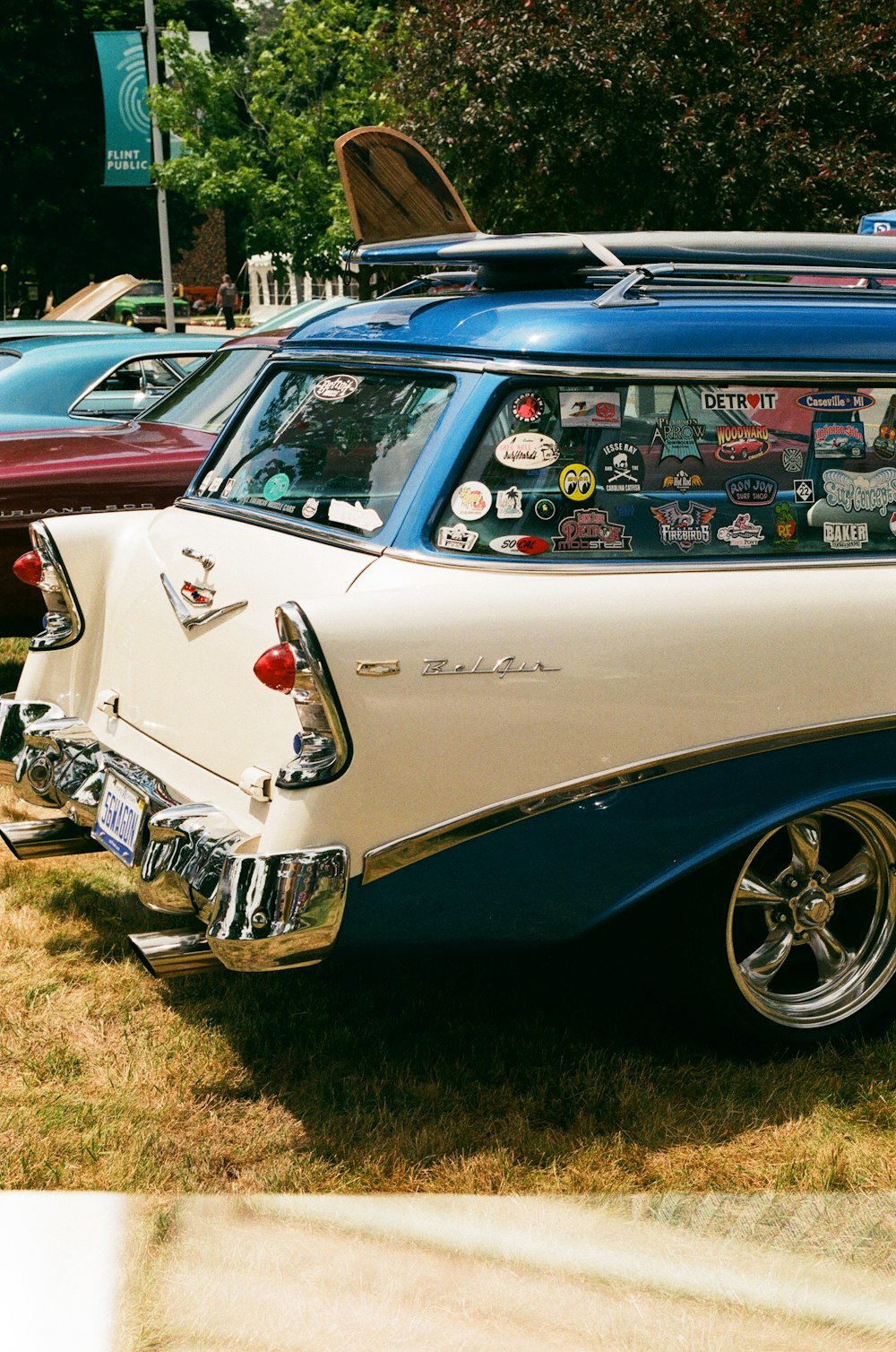 a car with a surfboard on top of it