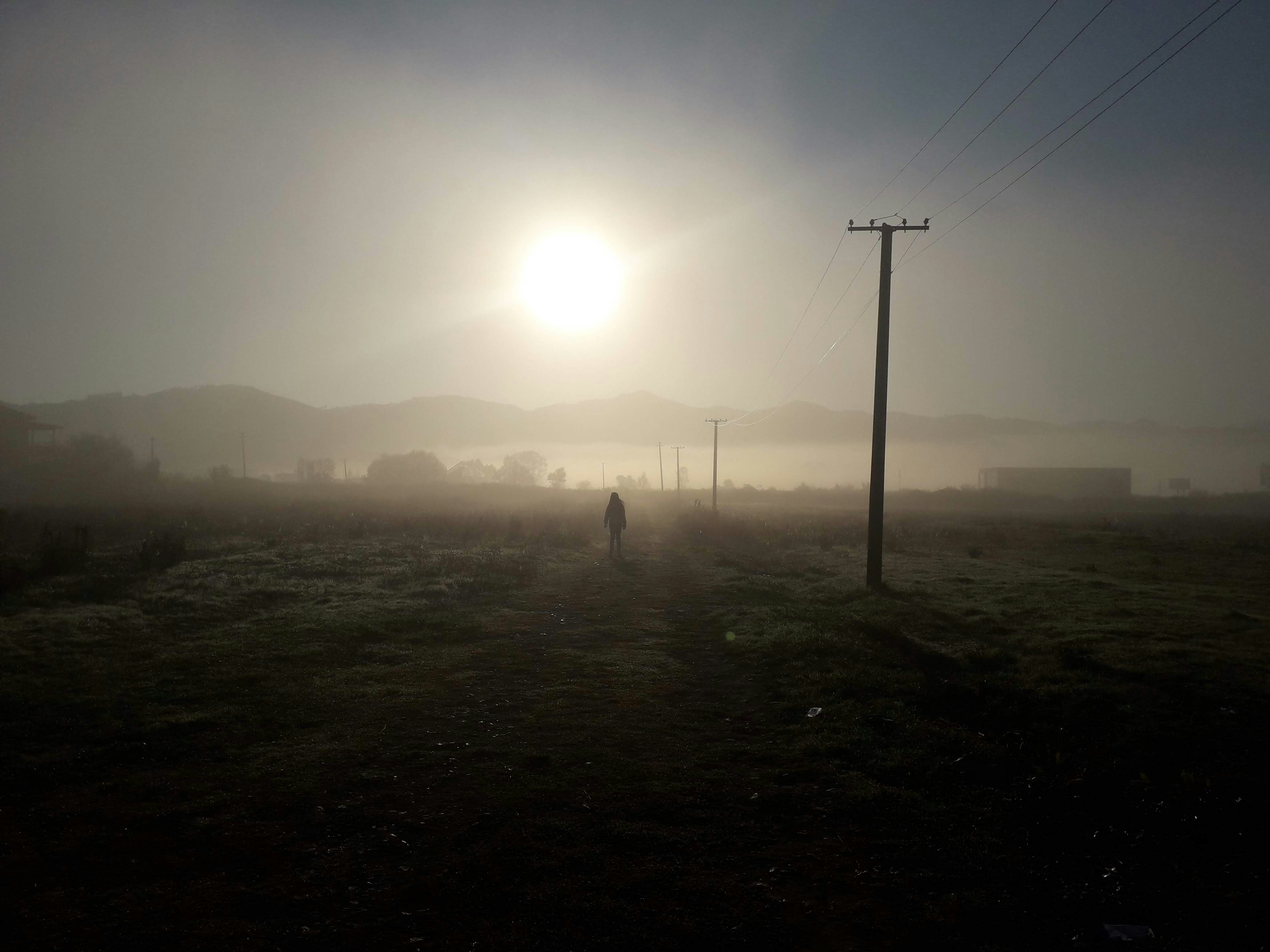 a person walking in a field