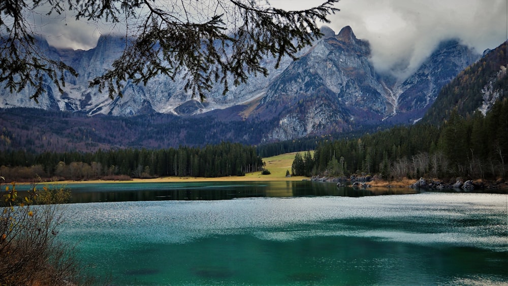 a lake with mountains in the background