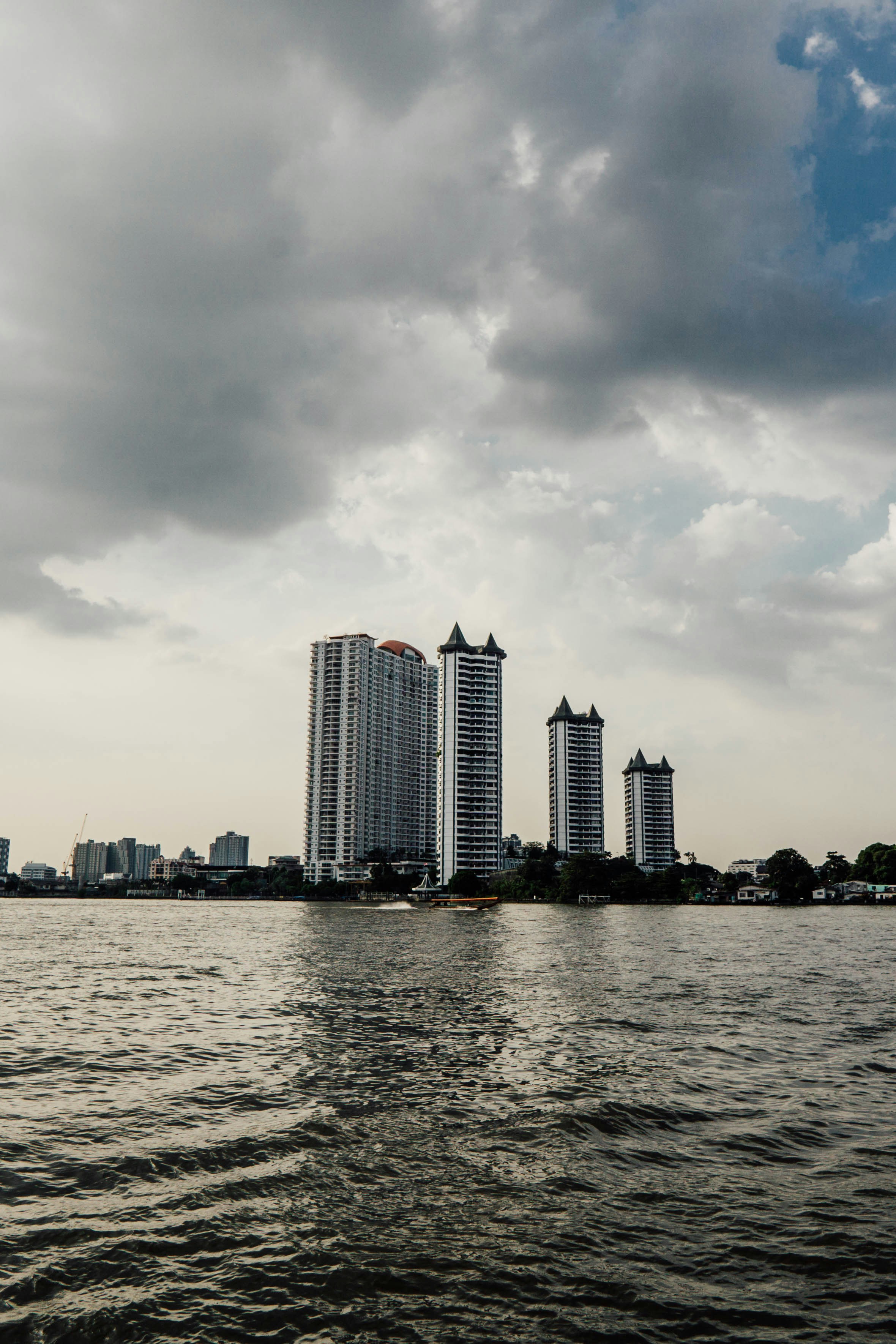 a body of water with a city in the background