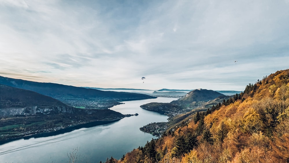 a river with a parachute flying over it