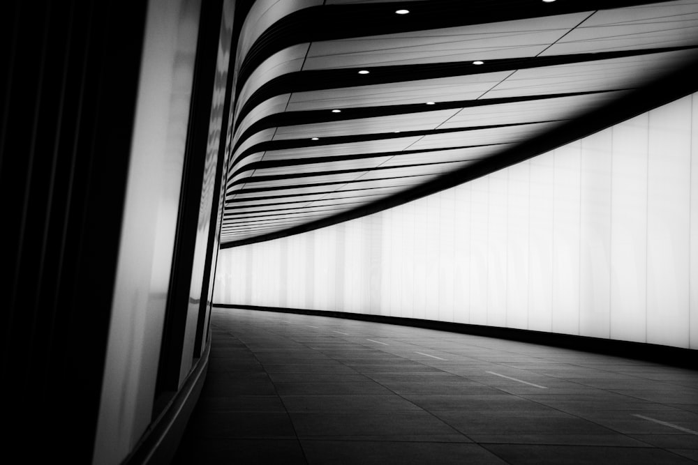 a hallway with a white wall