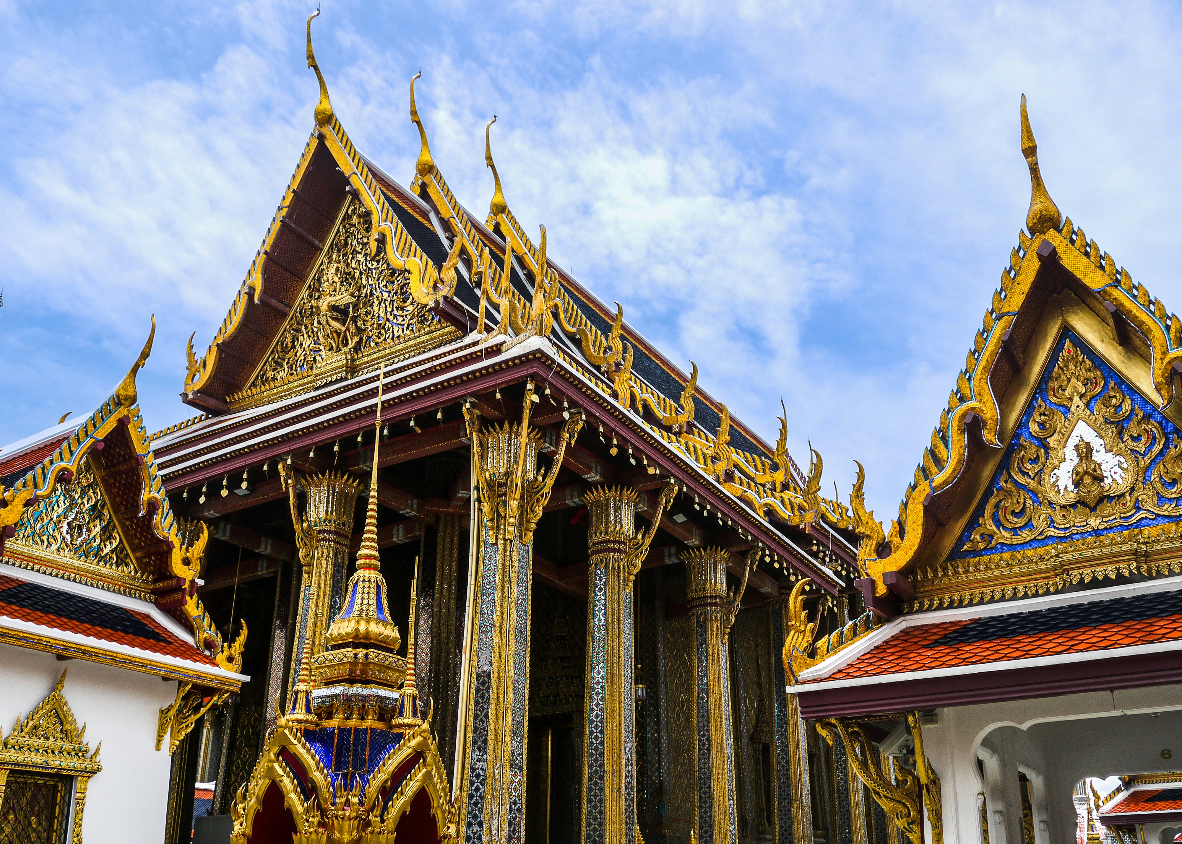 a building with ornate architecture, The Grand Palace of Bangkok.