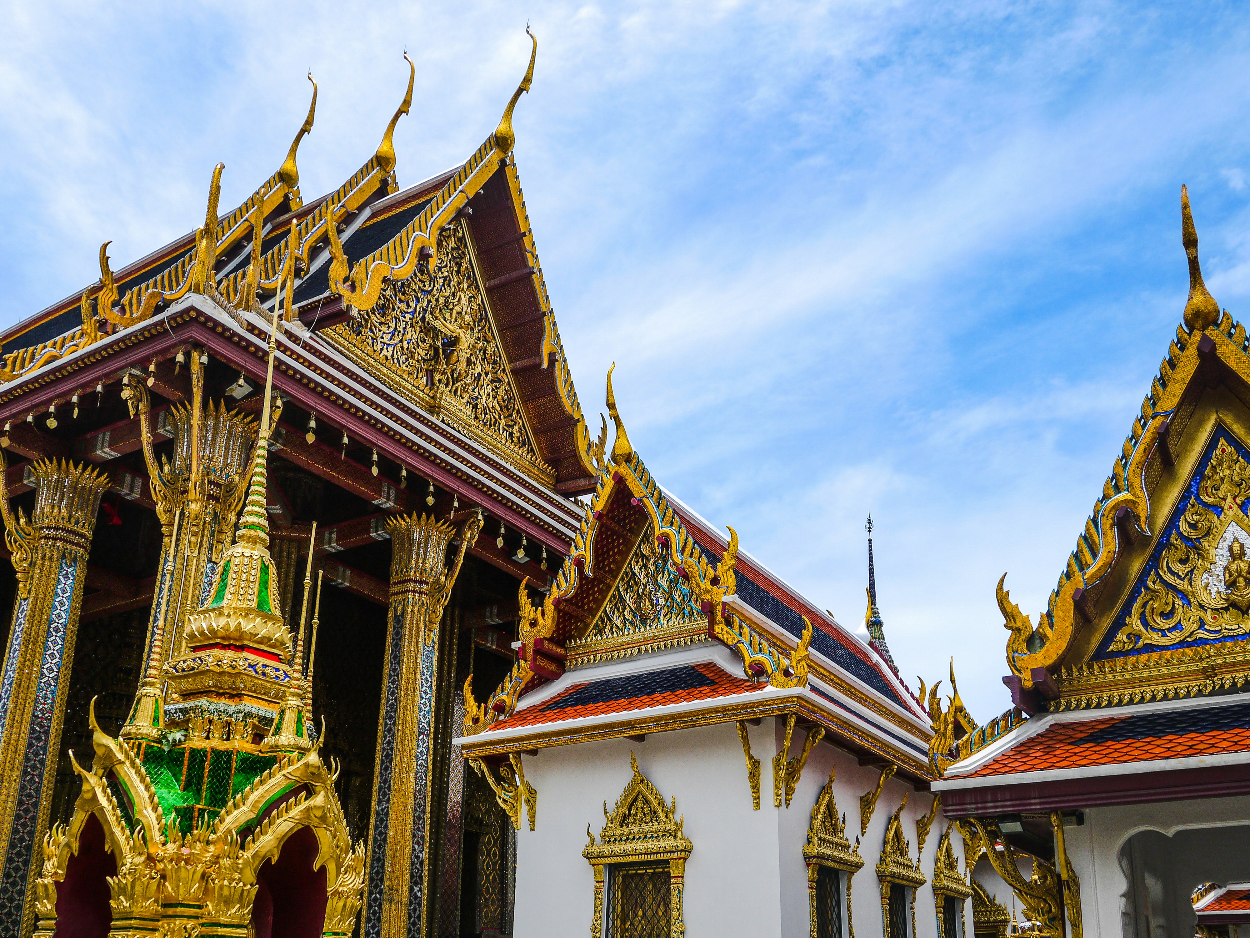a building with colorful architecture, The Grand Palace of Bangkok.