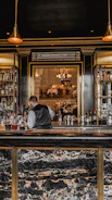 Elegant bartender serving drinks at a stylish wedding reception
