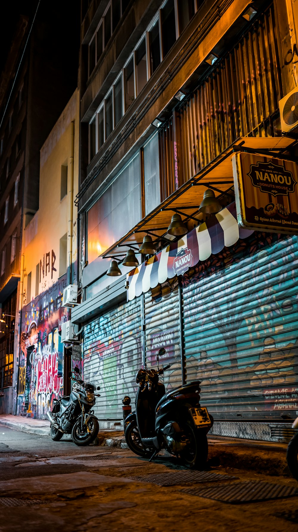 motorcycles parked on the side of a street