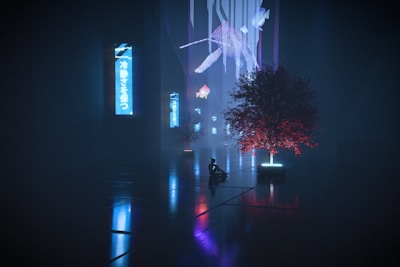 A futuristic scene with illuminated trees emitting blue and red lights. A silhouette of a person is seated near the trees, creating a sense of scale. Neon light panels with Japanese characters are vertically aligned along a long corridor, reflecting on the glossy floor. Geometric shapes and digital patterns hover in mid-air, adding a surreal touch.