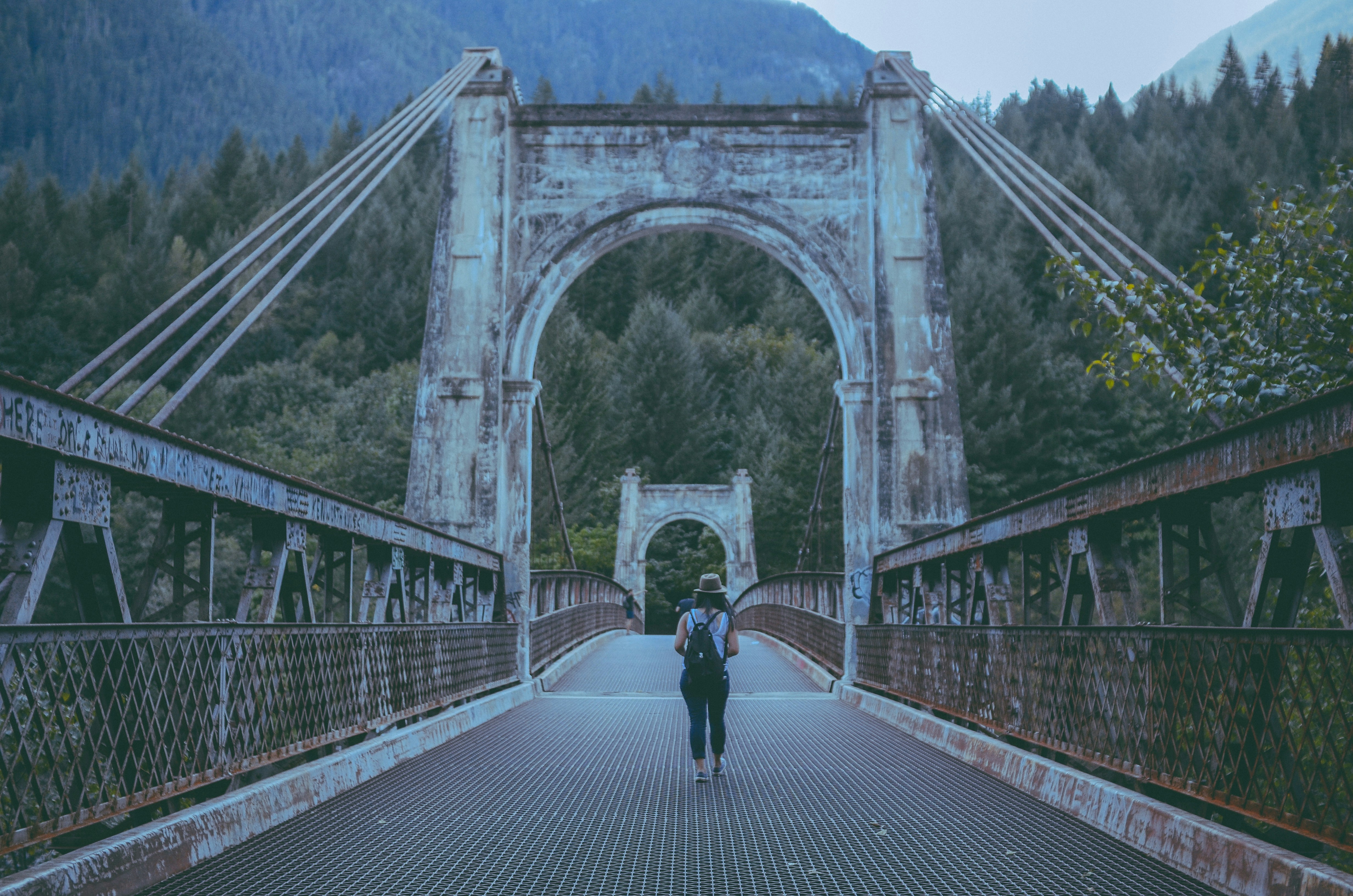 A person walking on a bridge photo – Free Bc Image on Unsplash