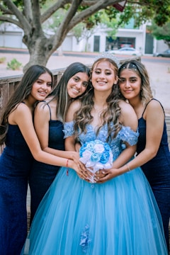 A group photo of pageant winners celebrating their achievements.