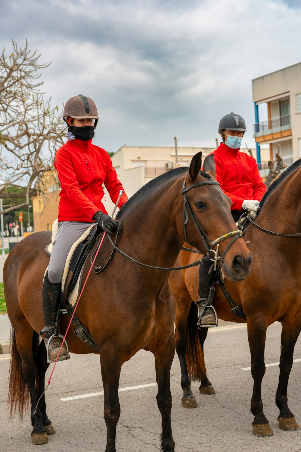 a couple of people ride on horses