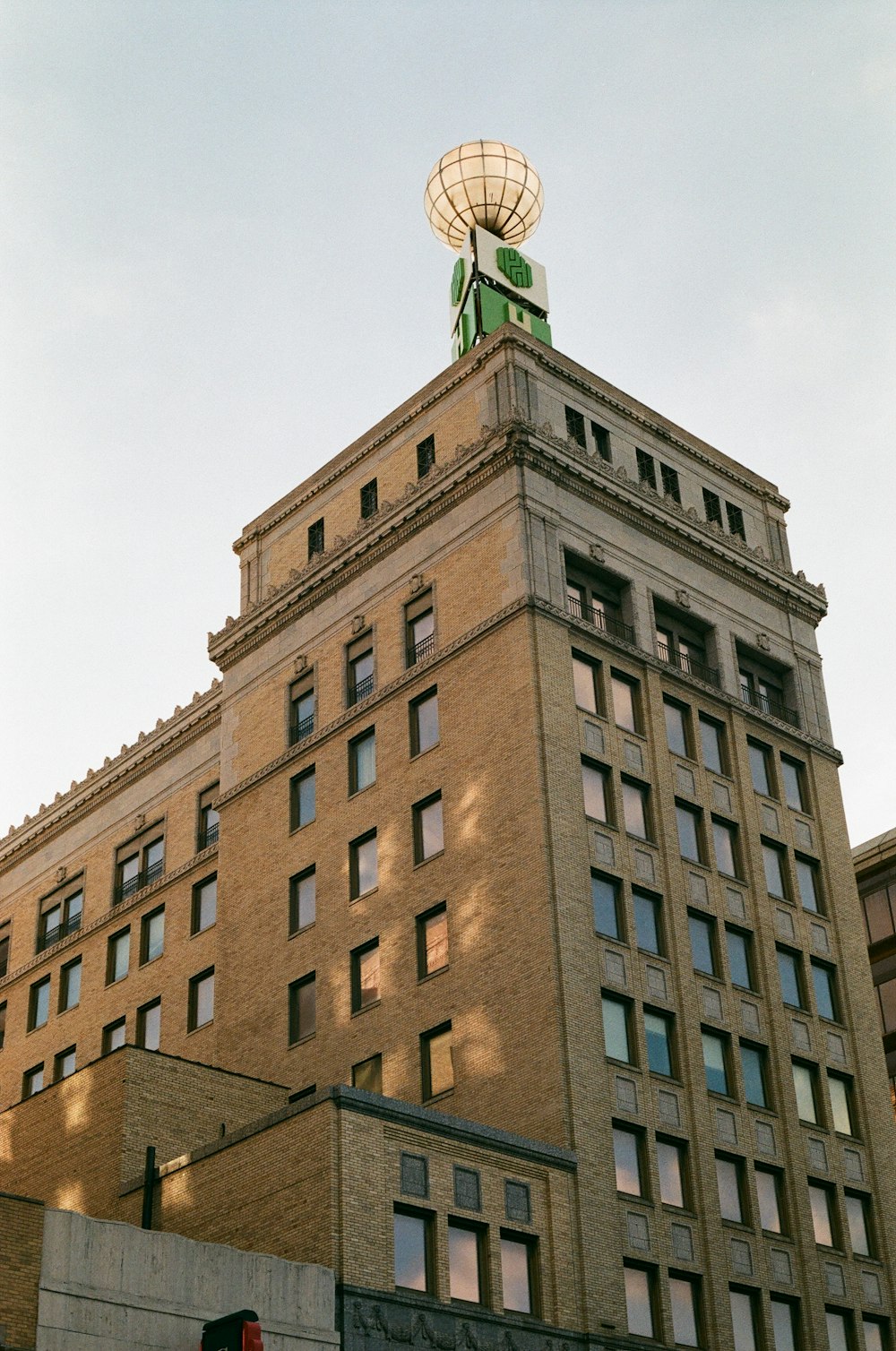 a tall building with a statue on top