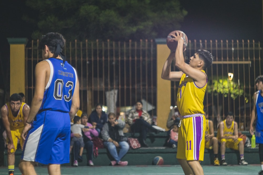 a group of people playing basketball