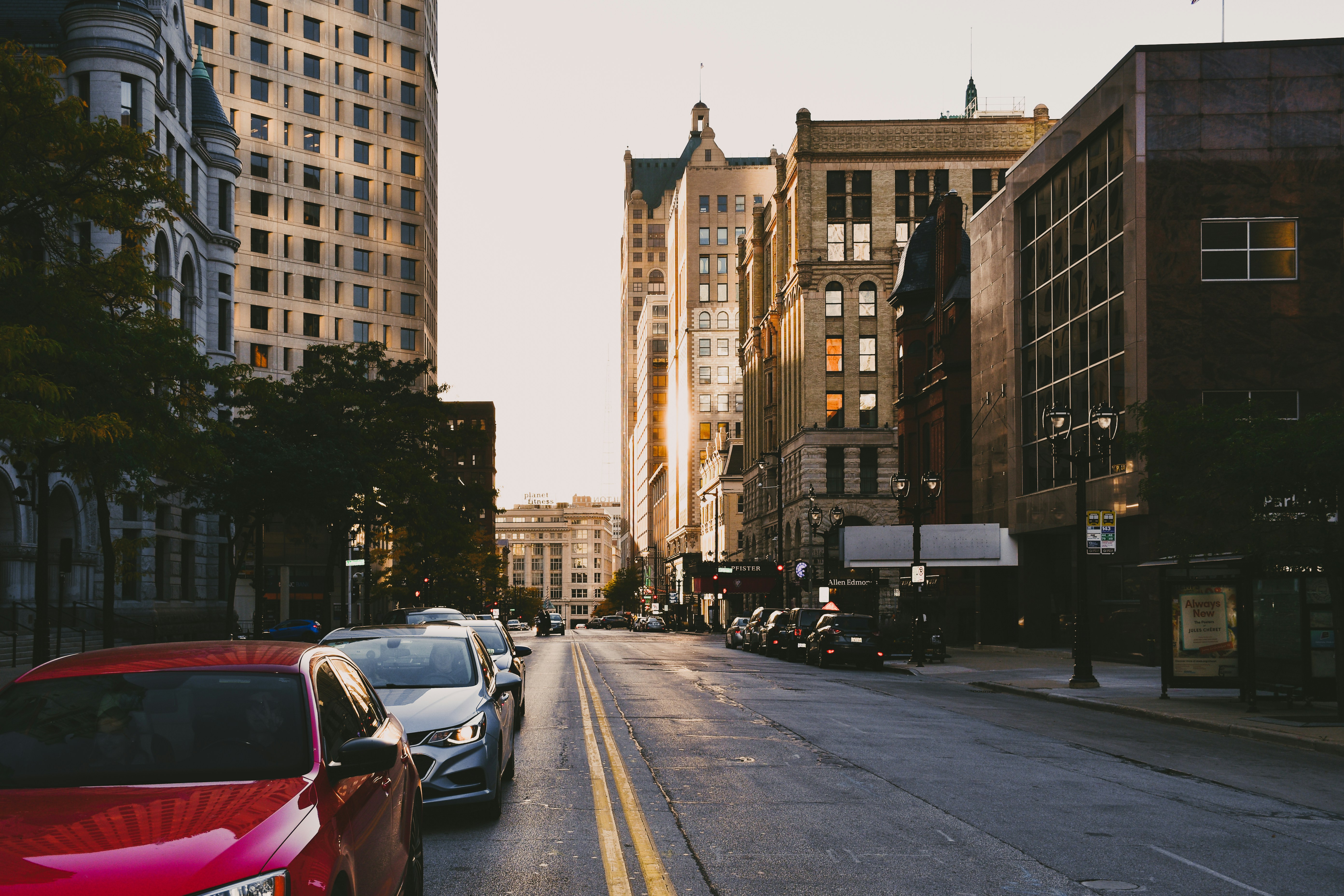 a street with cars and buildings on either side of it, Looking down East Wisconsin Avenue in downtown Milwaukee