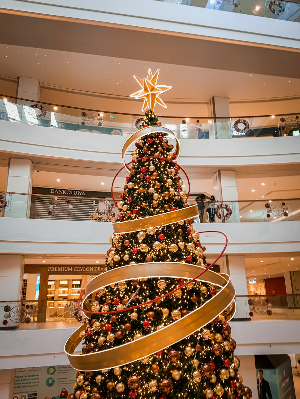 a large christmas tree in a building