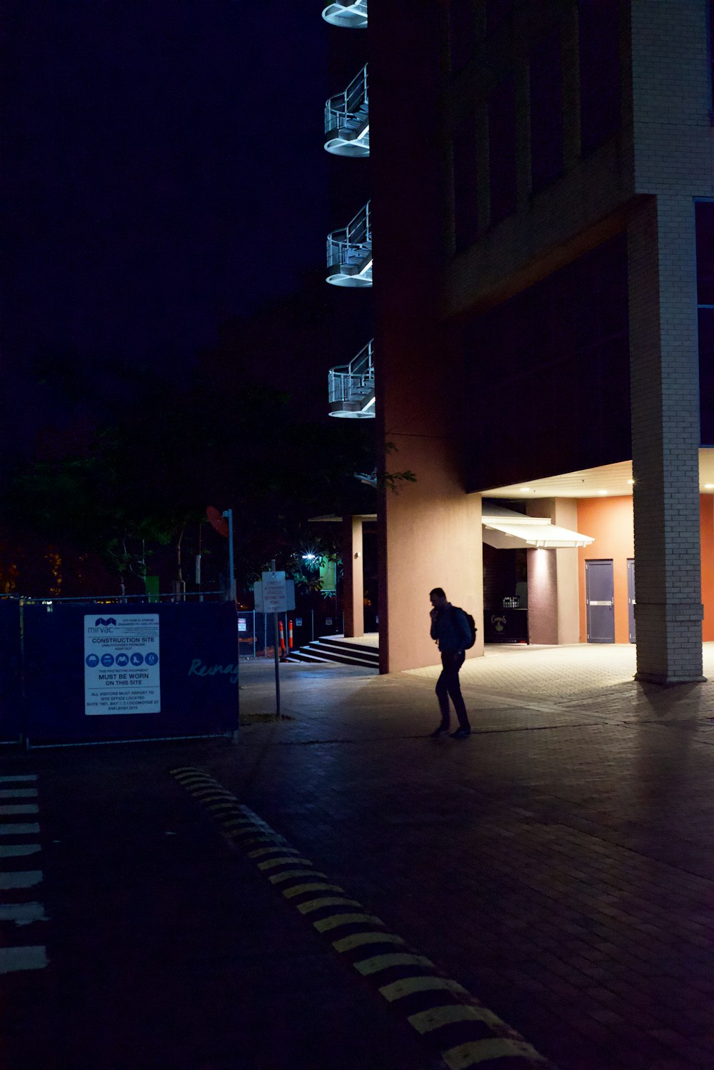 a person walking on a sidewalk