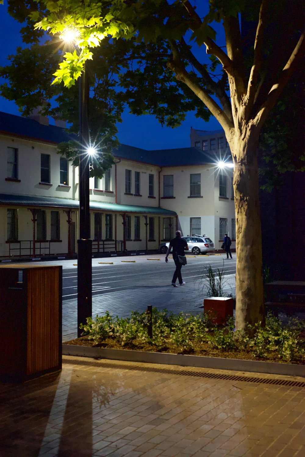 a person walking on a sidewalk