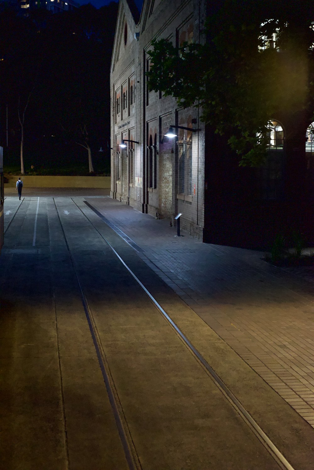 a person walking on a sidewalk