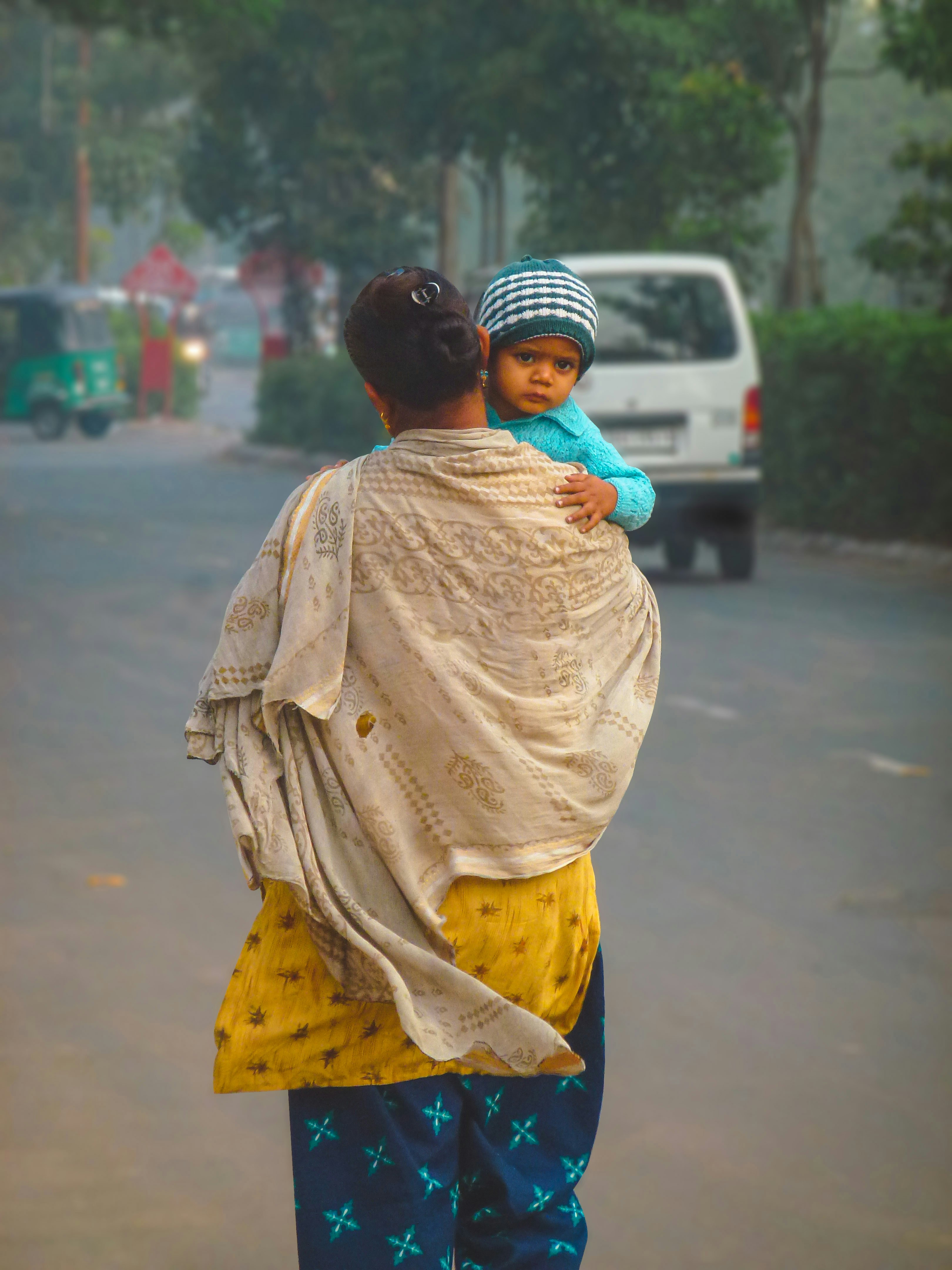 a person carrying a baby
