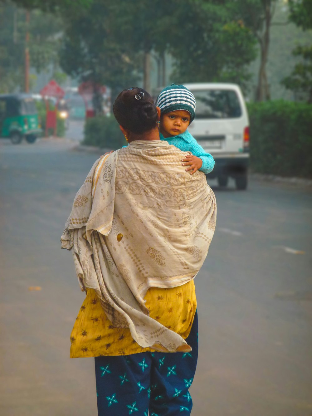 a person carrying a baby