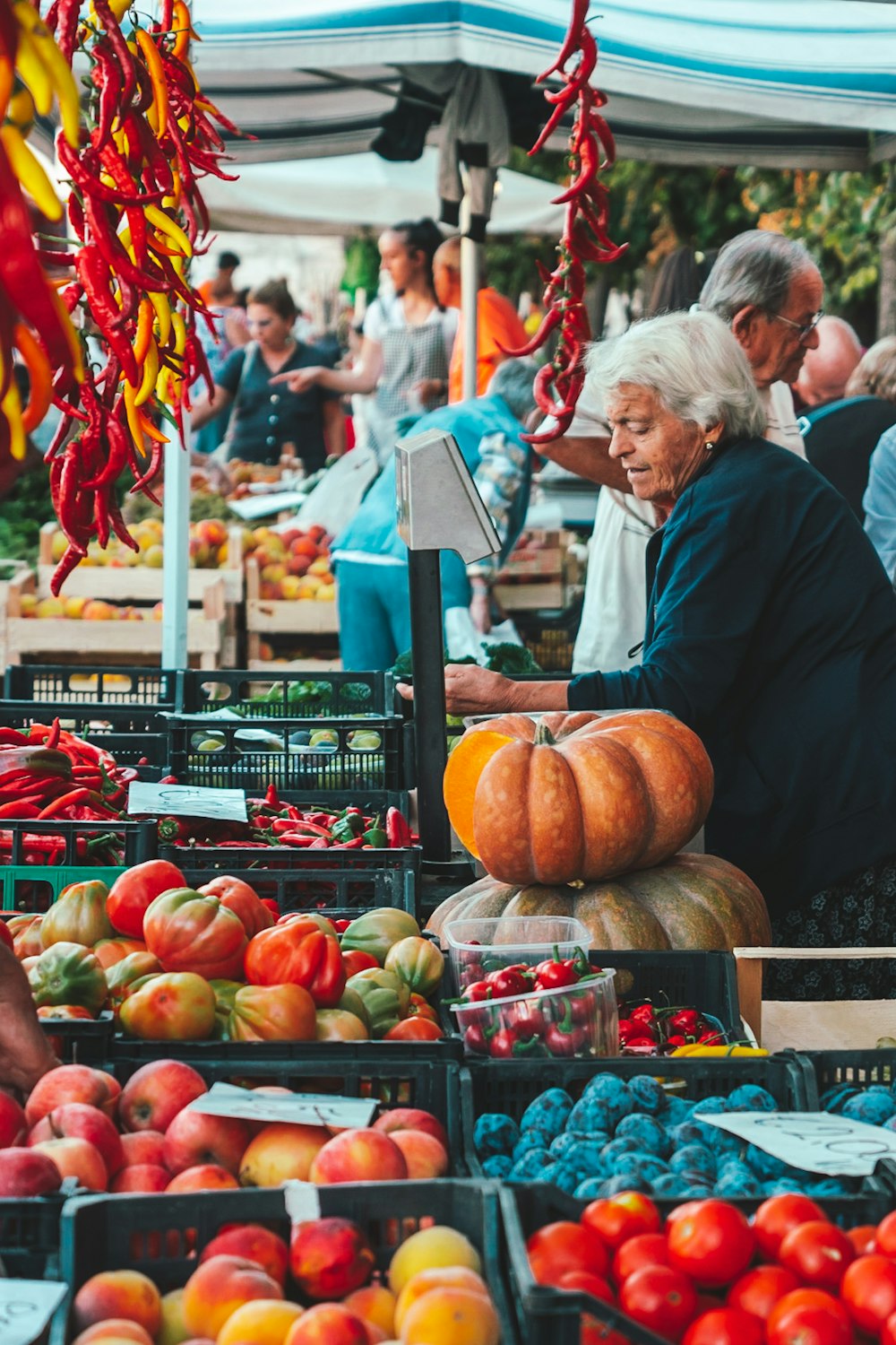 a couple of women at a farmers market