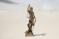 a statue of a person holding a staff