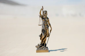 a statue of a person holding a staff