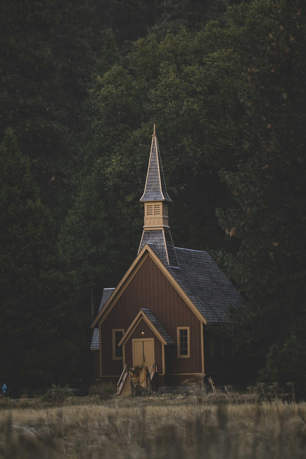 a wooden building with a steeple